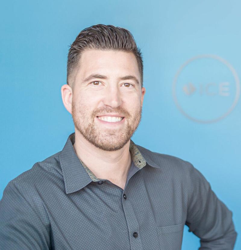 Dr. Kyle Bryant, DC, CCEP, chiropractor and inventor of The Vise, smiling in his clinic